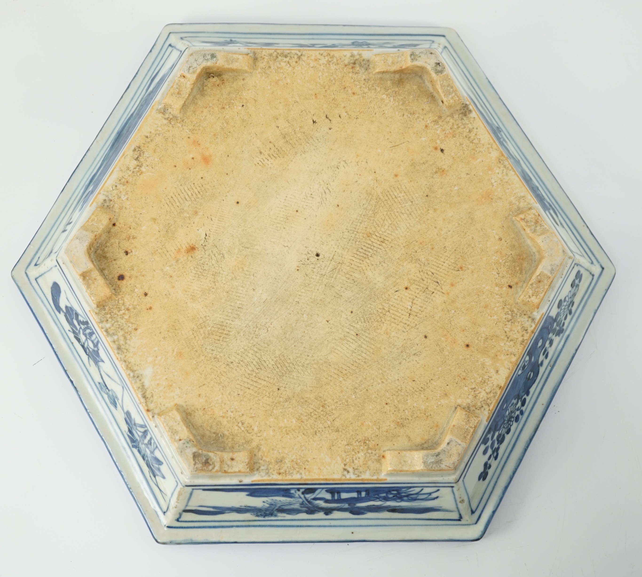 A Chinese hexagonal blue and white planter and underdish, 19th century, 35cm wide, two rim chips